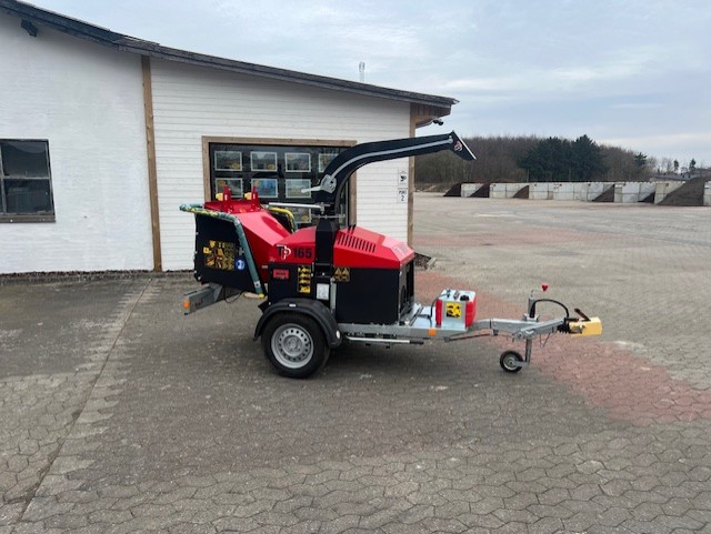 Eight shirts arranged on table in black, olive, grey, blue, white, red, mustard, and green.