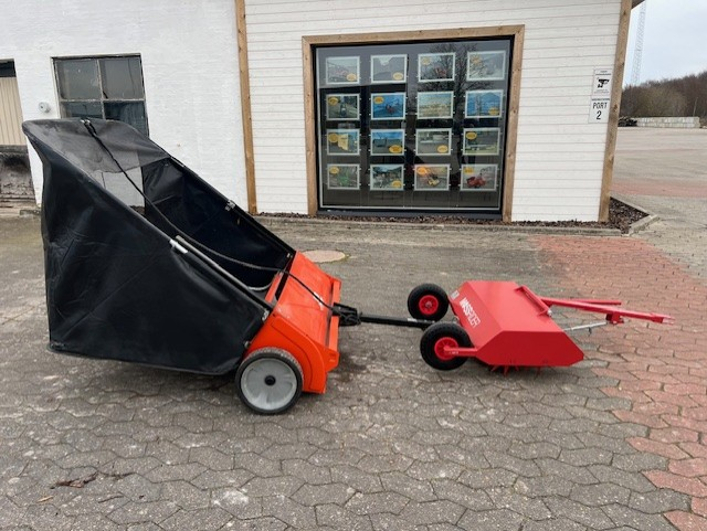 Eight shirts arranged on table in black, olive, grey, blue, white, red, mustard, and green.