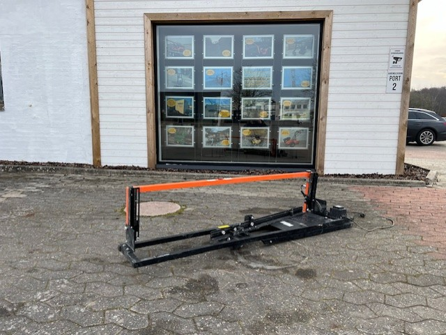 Eight shirts arranged on table in black, olive, grey, blue, white, red, mustard, and green.