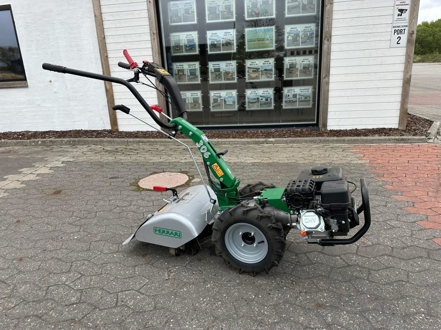 Eight shirts arranged on table in black, olive, grey, blue, white, red, mustard, and green.