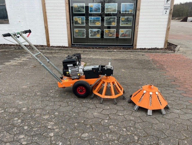 Eight shirts arranged on table in black, olive, grey, blue, white, red, mustard, and green.