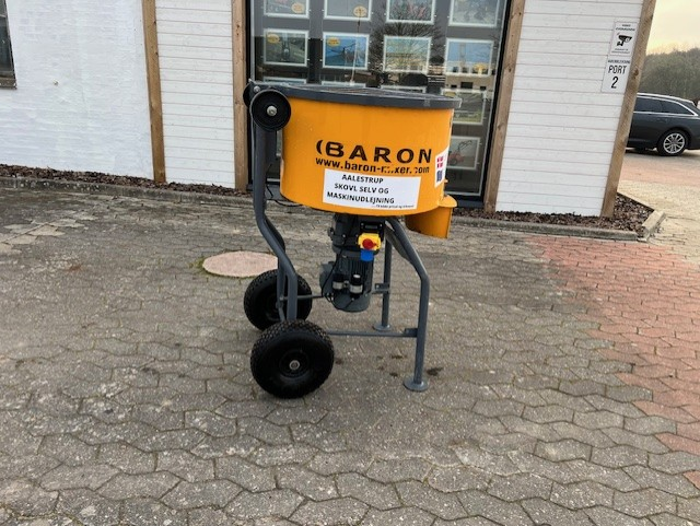 Eight shirts arranged on table in black, olive, grey, blue, white, red, mustard, and green.