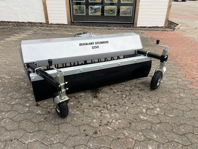 Eight shirts arranged on table in black, olive, grey, blue, white, red, mustard, and green.